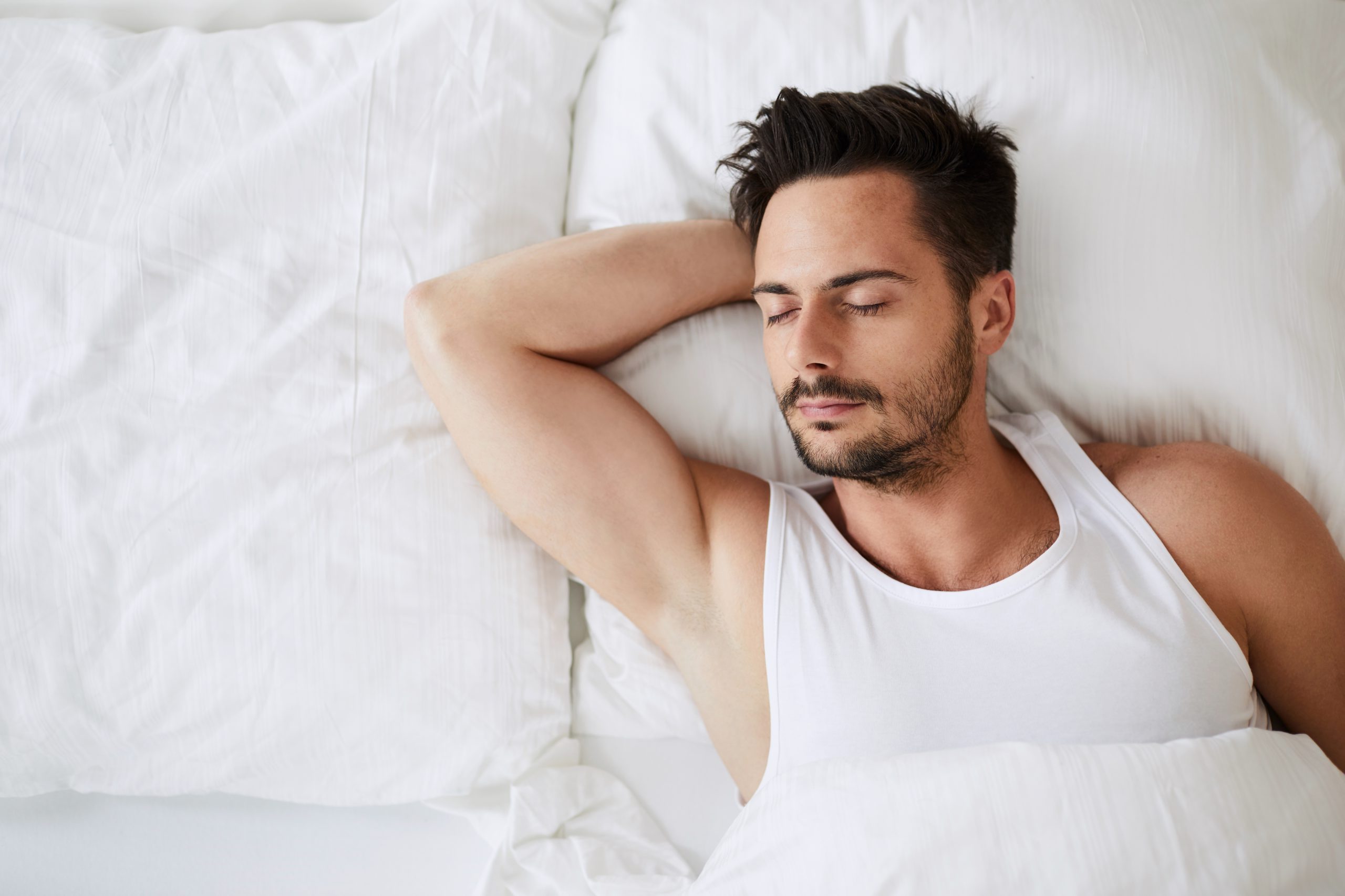 Intimate surgery for men – man lying in bed